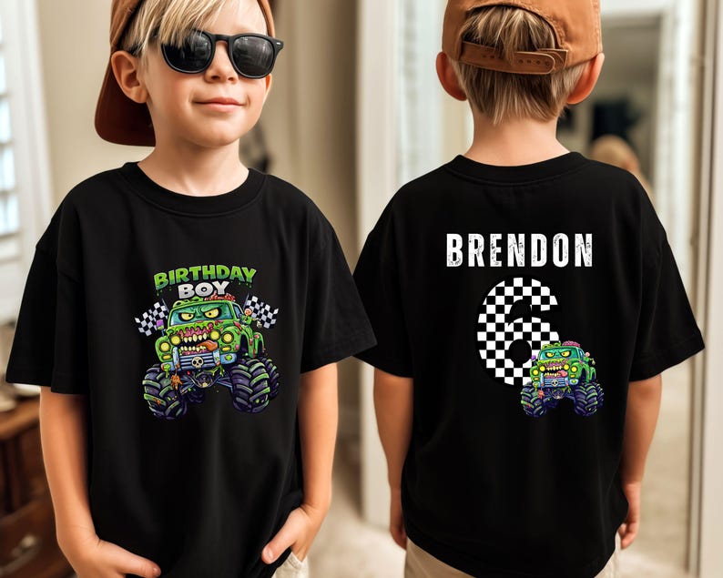 May include: Black t-shirt with a green monster truck graphic and the words "BIRTHDAY BOY" on the front. The back shows the name "BRENDON" and the number "6" in a chequered pattern, plus a smaller monster truck graphic.