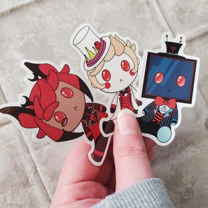 Demon Hotel Inspired Doll Stickers-Alastor, Lucifer, Vox, Charlie, Vaggie, Angel, Husk, Adam, Lute, Nifty, Velvette, and Sir Pentious