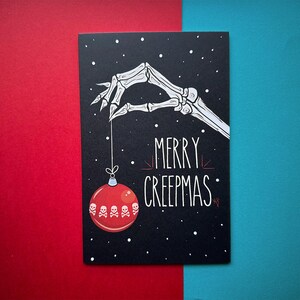 Merry Creepmas Greeting Card: Spooky Skull Holiday Art, Gothic Christmas Red