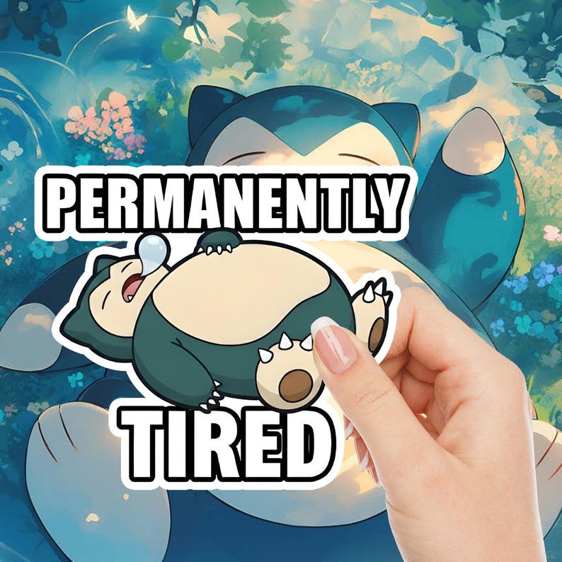 May include: A sticker featuring a cartoon Snorlax character, sleeping with a bubble above its head. The text "PERMANENTLY TIRED" is displayed in bold white letters with a black outline. The background is a blue and green illustration.