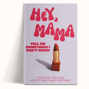 May include: A book cover with the text "HEY, MAMA" in red, stylized letters. Below, the text reads "TELL ME SOMETHING I DON'T KNOW." A lipstick is featured, with a gold tube and a reddish-brown lipstick. The book is a family keepsake.