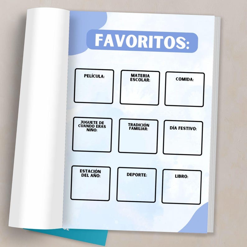 May include: Open notebook page with the word "FAVORITOS:" in blue. Below are nine blank boxes labeled in Spanish: "PEL&Iacute;CULA:" "MATERIA ESCOLAR:" "COMIDA:" "JUGUETE DE CUANDO ERAS NI&Ntilde;O:" "TRADICI&Oacute;N FAMILIAR:" "D&Iacute;A FESTIVO:" "ESTACI&Oacute;N DEL A&Ntilde;O:" "DEPORTE:" and "LIBRO:"