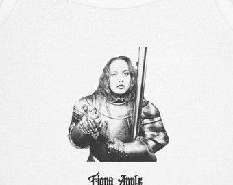 May include: White tank top featuring a black and white graphic of a person in armor holding a pole. The text "Fiona Apple" is printed in a gothic font below the graphic. The tank top has thin straps.