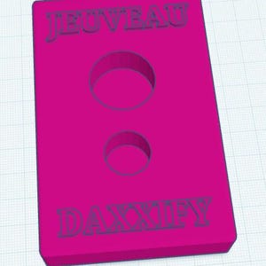 May include: A magenta rectangular object with two circular cutouts. The word "JEUVEAU" is at the top and "DAXXIFY" at the bottom, both in a darker shade of purple. The object is set against a grid background.