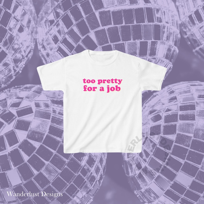 May include: White t-shirt with the text "too pretty for a job" in pink letters.
