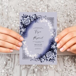 May include: A purple wedding invitation with a floral design featuring blue roses and vines. The invitation text reads "Feyre & Rhysand" and includes the date "09.24.25".