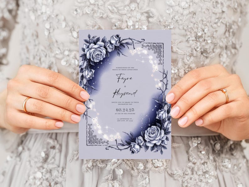 May include: A purple wedding invitation with a floral design featuring blue roses and vines. The invitation text reads "Feyre & Rhysand" and includes the date "09.24.25".