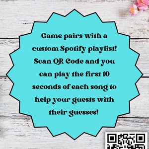 May include: A teal blue starburst shape with the text "Game pairs with a custom Spotify playlist! Scan QR Code and you can play the first 10 seconds of each song to help your guests with their guesses!" A black and white QR code is in the bottom right corner.