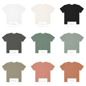 May include: Nine solid-color t-shirts in a variety of hues, including white, ivory, black, pepper, moss, bay, khaki, terracotta, and yam. Each shirt is displayed with a label indicating its color name.