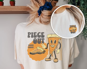 May include: A white t-shirt with a retro-style pizza graphic and the text "Piece Out" and "Yummy Yummy".