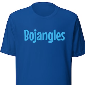May include: A blue t-shirt with the word "Bojangles" printed in light blue across the chest. The shirt is a solid color and appears to be made of a soft material. The design is simple and eye-catching.