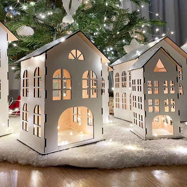 Wit HDF-kerstdorpshuis: rustiek vakantiedecor