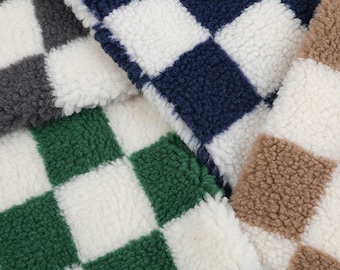 May include: Close-up of four fabric swatches with a checkered pattern. The swatches are in shades of gray, navy blue, green, and brown.