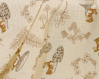 May include: A cream-colored fabric with a repeating pattern of brown bunnies, mushrooms, and leaves. The fabric has a textured waffle weave.