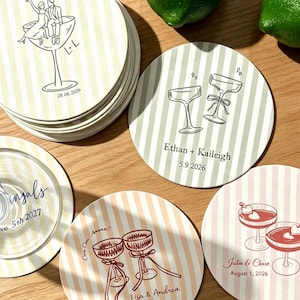 May include: A collection of round drink coasters featuring vertical stripes in pastel colours. Each coaster displays line art illustrations of cocktail glasses and personalised text including names and dates such as Ethan + Kaileigh 5.9.2026.