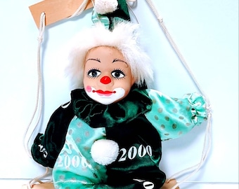 Vintage Porcelain Head Clown Doll body sitting on a Swing Hand painted