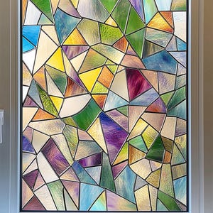 May include: A stained glass window film with a geometric pattern in shades of blue, green, purple, and yellow.