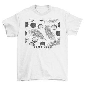 May include: White t-shirt with a black and white graphic print of coconuts and palm leaves. The text "TEXT HERE" is printed below the graphic.