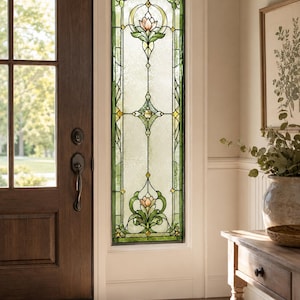 May include: A tall, rectangular stained glass window panel featuring a symmetrical floral design with pink lotus-like flowers, green leaves, and yellow accents. The glass has a textured, semi-opaque finish with clear leaded lines.