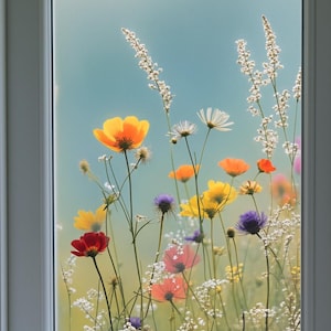 May include: A window with a floral design featuring colorful wildflowers. The flowers include yellow, orange, red, purple, and white blooms, set against a soft blue background. The window frame is white.