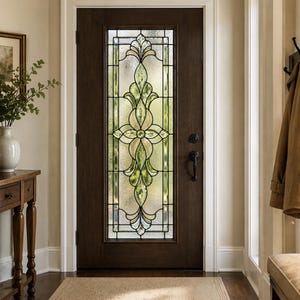 May include: A dark brown wooden front door with a decorative stained glass window. The glass features a floral design with green and yellow hues. The door is set in a white-trimmed frame, with a small rug on the floor.
