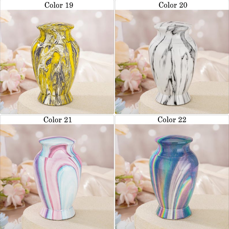 May include: Four small decorative urns with lids, each featuring a unique marbled finish. Color 19 is yellow and black, Color 20 is white and black, Color 21 is pastel pink and blue, and Color 22 displays a vibrant iridescent blue and purple swirl.