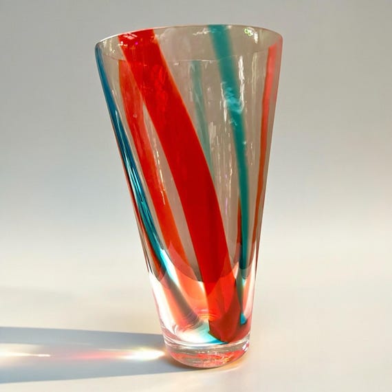 A genuine vintage mid-century handblown glass striped vase — the kind of bold, colorful statement piece that anchors a whole room and can't be replicated.