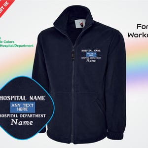 May include: Navy blue zip-up jacket with embroidered text: "HOSPITAL NAME", "HOSPITAL DEPARTMENT", and "Name". A patch with the same text is also visible. The jacket is designed for workers.