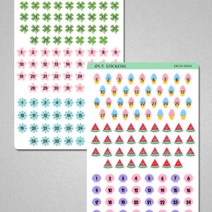 May include: A set of 31 sticker sheets with different designs. The first sheet features green four-leaf clovers with numbers 1-31. The second sheet features pink and blue ice cream cones with numbers 1-31. The third sheet features watermelon slices with numbers 1-31. The fourth sheet features purple and pink seashells with numbers 1-31.
