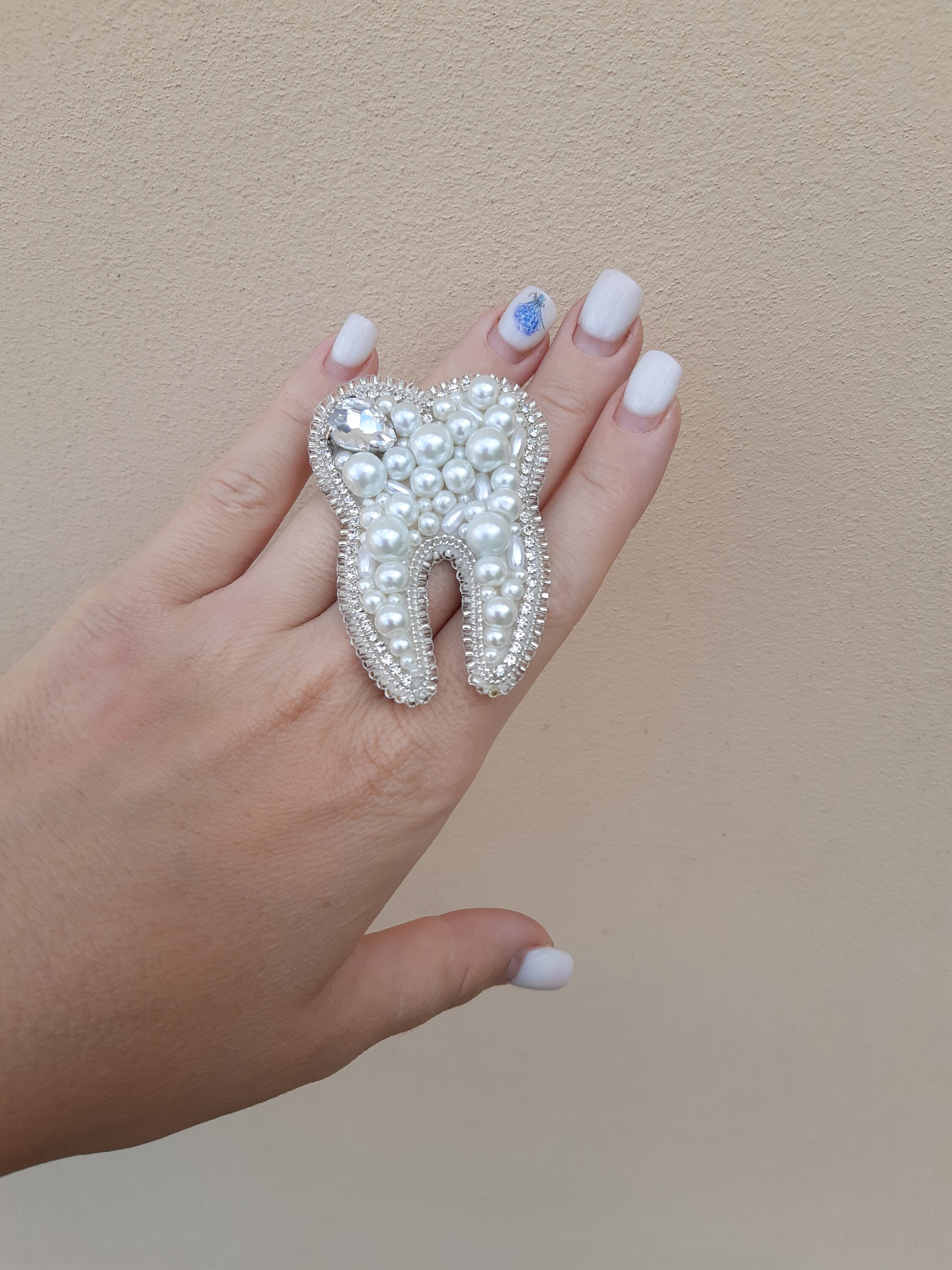 Tooth brooch deals