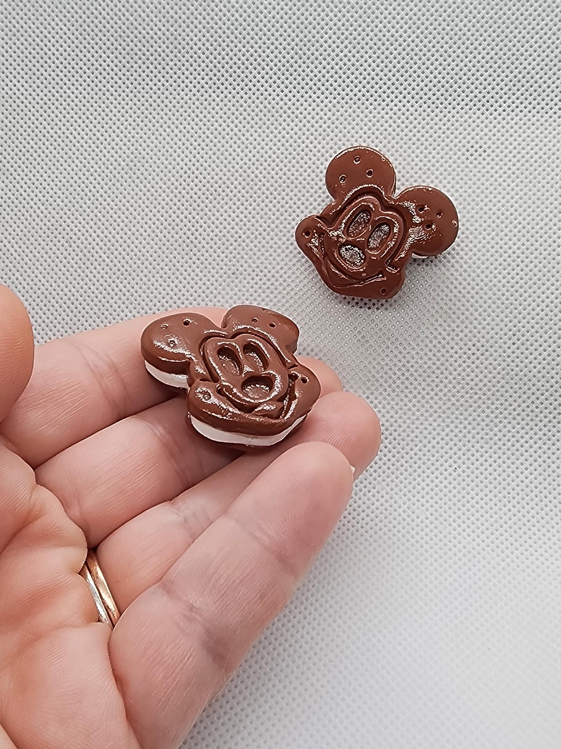Premium AI Image | mickey mouse ice cream with blue and white frosting in a cone generative ai