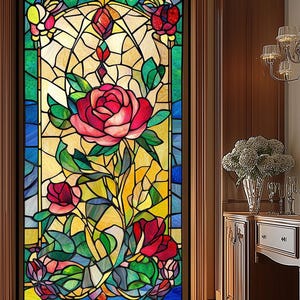 May include: A stained glass window featuring a floral design with a large pink rose and smaller red roses. The window is framed in wood and has a blue, green, and yellow colour scheme.