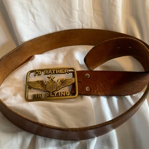 vintage solid brass belt buckle w/leather belt. “I’d rather be flying” aviation, pilot