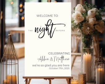 May include: A cream-colored welcome sign on a wooden easel. The sign reads "Welcome to the night before" in elegant black script, celebrating Abbie & Matthew, October 17th, 2025. Decorative candles and floral arrangements are in the background.