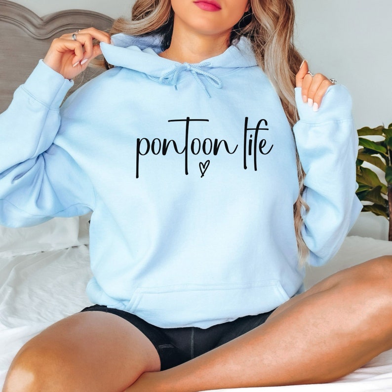 May include: A light blue hooded sweatshirt with the text "pontoon life" in black lettering and a small heart symbol.