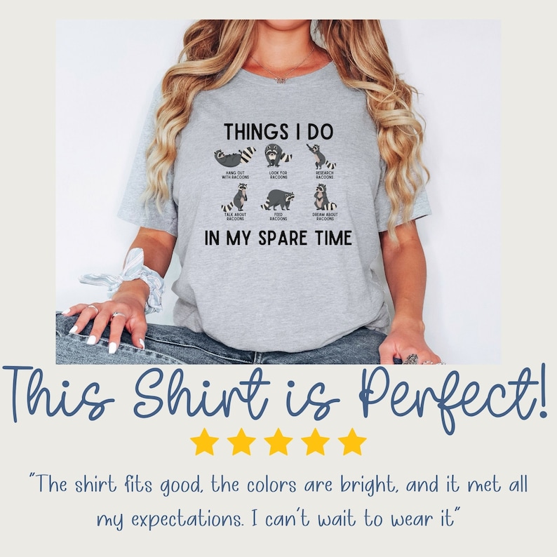 May include: A grey t-shirt featuring a graphic of raccoons and the text "THINGS I DO IN MY SPARE TIME". The text lists activities related to raccoons, such as "hang out with raccoons", "look up raccoon facts", and "dream about raccoons".