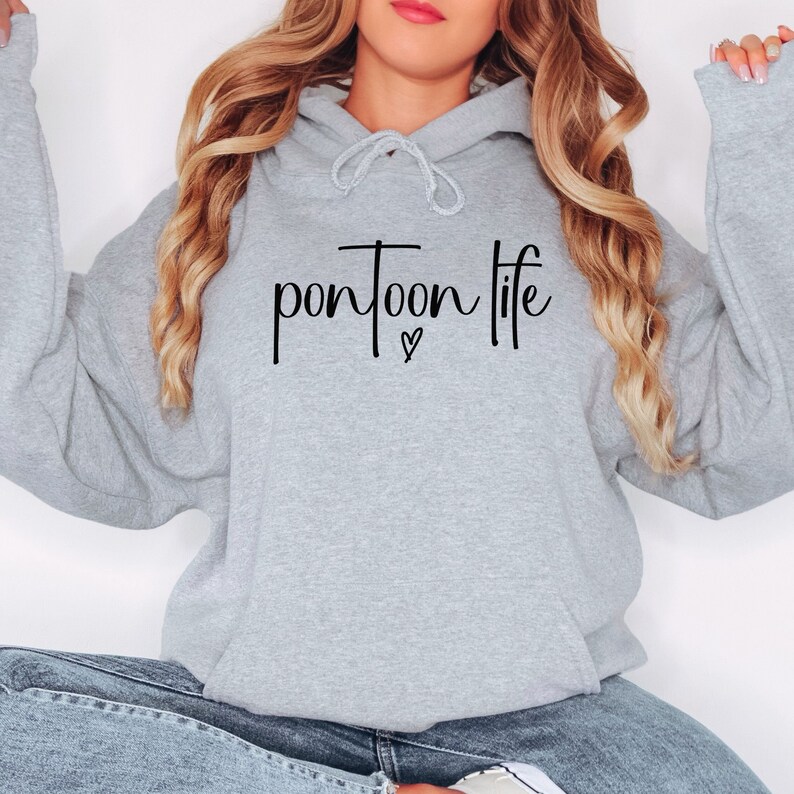 May include: A gray hooded sweatshirt with the text "pontoon life" in black lettering and a small heart symbol.