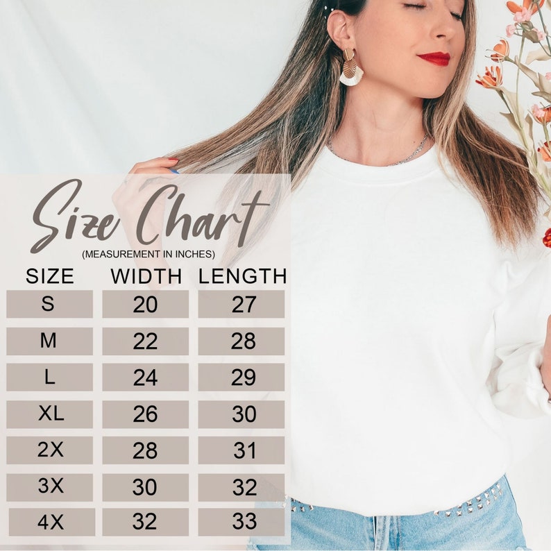 May include: Size chart for a white sweatshirt with measurements in inches. The chart shows the width and length of the sweatshirt in sizes S, M, L, XL, 2X, 3X, and 4X.