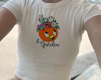 Baby-shirt oranje vogel bloementuin, bloemenfestivalgewas, bloemen epcot-gewas, oranje vogelgewas, crop top met verzinsel