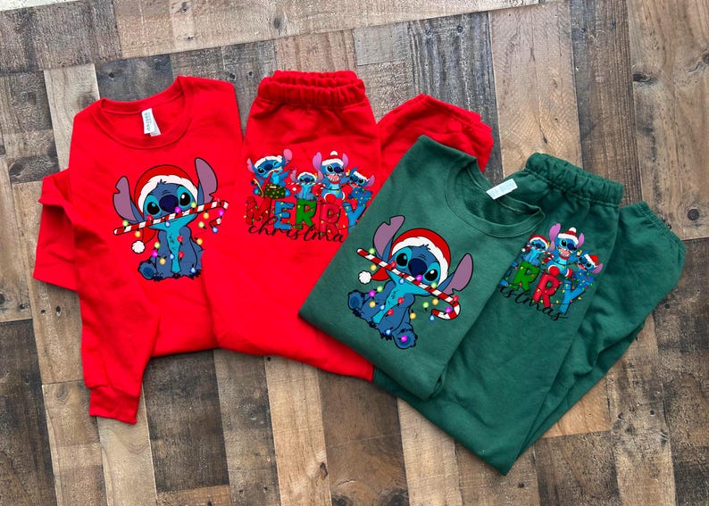 May include: Red and green Christmas themed shirts featuring Stitch from Lilo & Stitch. The red shirt has a group of Stitch characters with the text "Merry Christmas". The green shirt has a single Stitch character holding a candy cane and lights with the text "Merry Christmas".