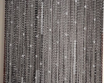 Dark curtain with silver thread beaded curtain