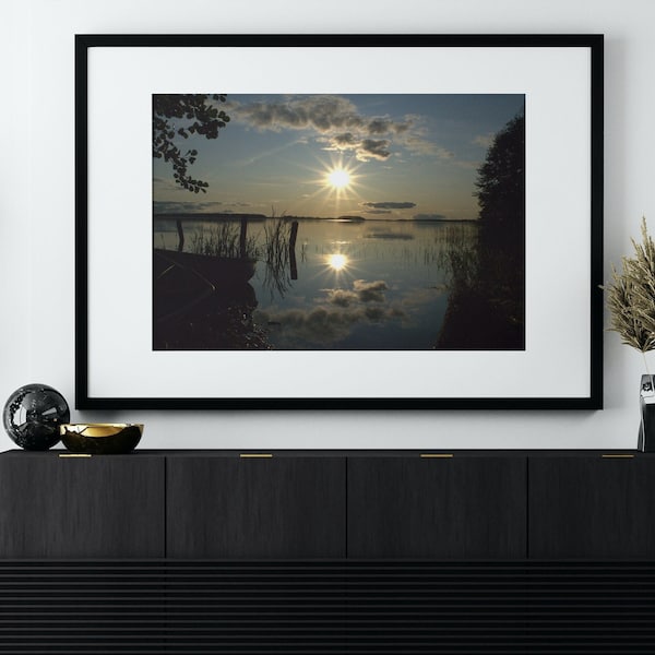 A colorful sunset on an August evening. Lake shore. Waters. Lake. Beautiful image. Lake Karhijärvi in Finland. Printable.