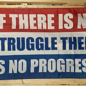 May include: A red, white and blue flag with the text "If there is no struggle there is no progress" printed in white.