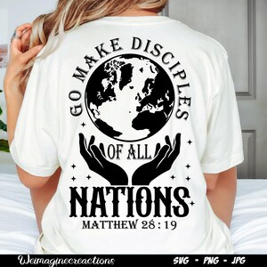May include: White t-shirt with black text that reads "Go Make Disciples of All Nations Matthew 28:19". The text is surrounded by a globe, stars, and two hands holding the globe.