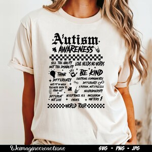 May include: A white t-shirt with a black graphic design that says "Autism Awareness" and includes a list of phrases about acceptance and neurodiversity. The graphic design is in a grunge style with a checkered border.