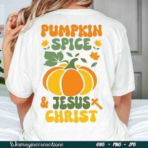 May include: Cream-colored t-shirt with a fall-themed graphic. The design features the text "PUMPKIN SPICE & JESUS CHRIST" in orange, green, and yellow, along with a pumpkin and leaves.