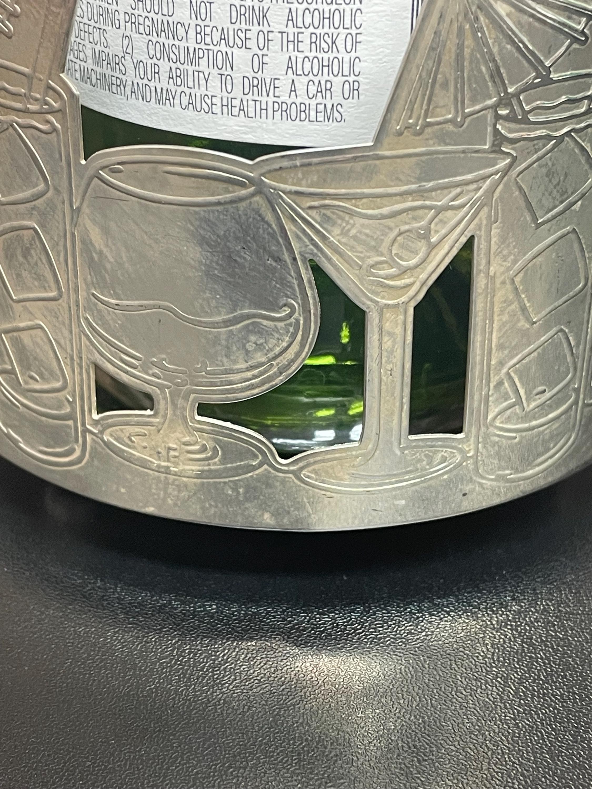 Paire de sous-verres à bouteilles en métal argenté avec côtés Paire de sous-verres à bouteilles en métal argenté avec côtés
