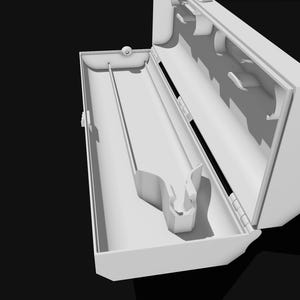 May include: White plastic wrap dispenser with a roll of plastic wrap inside. The dispenser is open and the roll is partially unwound.