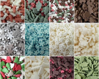 May include: Assortment of colorful sprinkles in various shapes, including snowflakes, stars, trees, and candy canes. The sprinkles are perfect for decorating cakes, cupcakes, cookies, and other desserts.