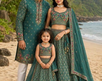 May include: A teal green ensemble featuring a long-sleeved kurta with intricate embroidery paired with white trousers, alongside two matching lehenga sets consisting of sleeveless crop tops and full-length skirts with floral hem detailing.